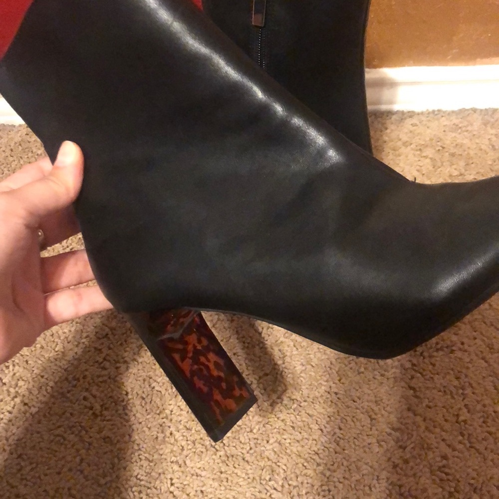 Black ankle bootie with tortoise heel